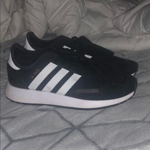 Black and white adidas tennis shoes